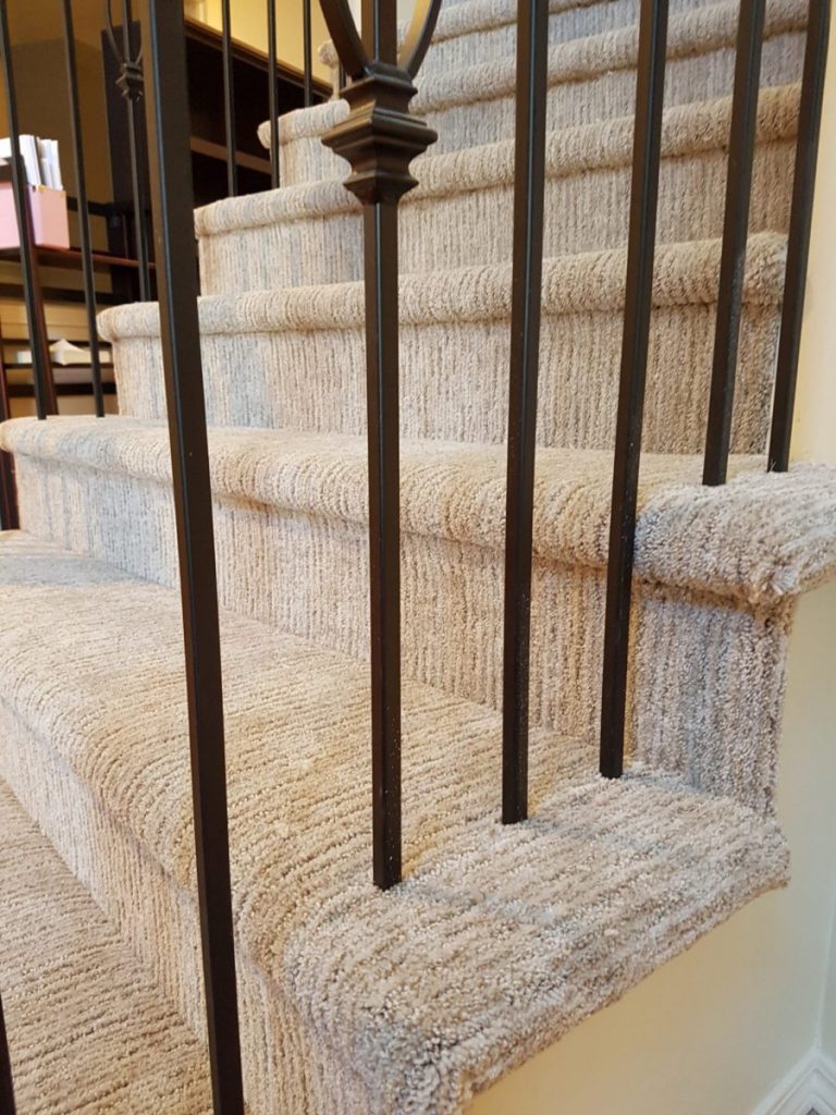 detailed carpet install on stairs