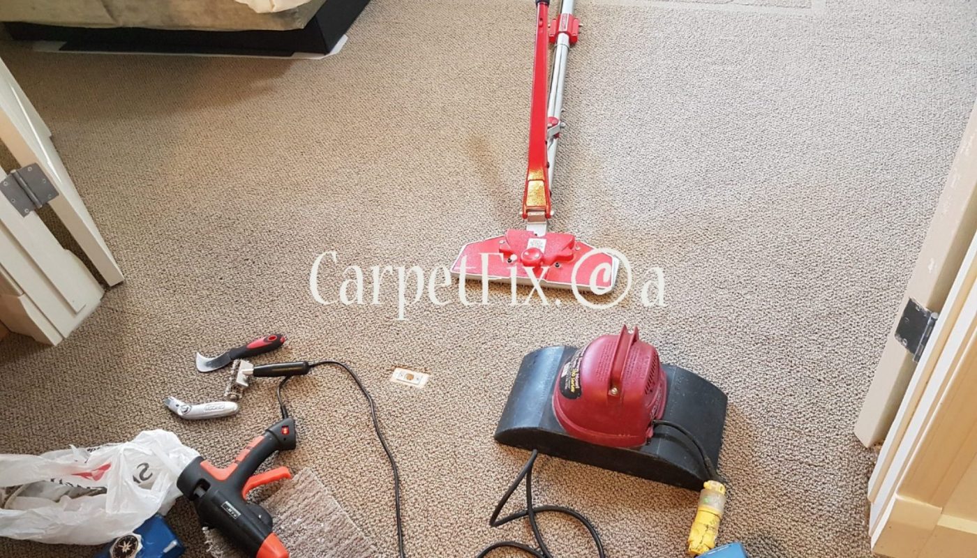 Carpet Stretching with some furniture in the room